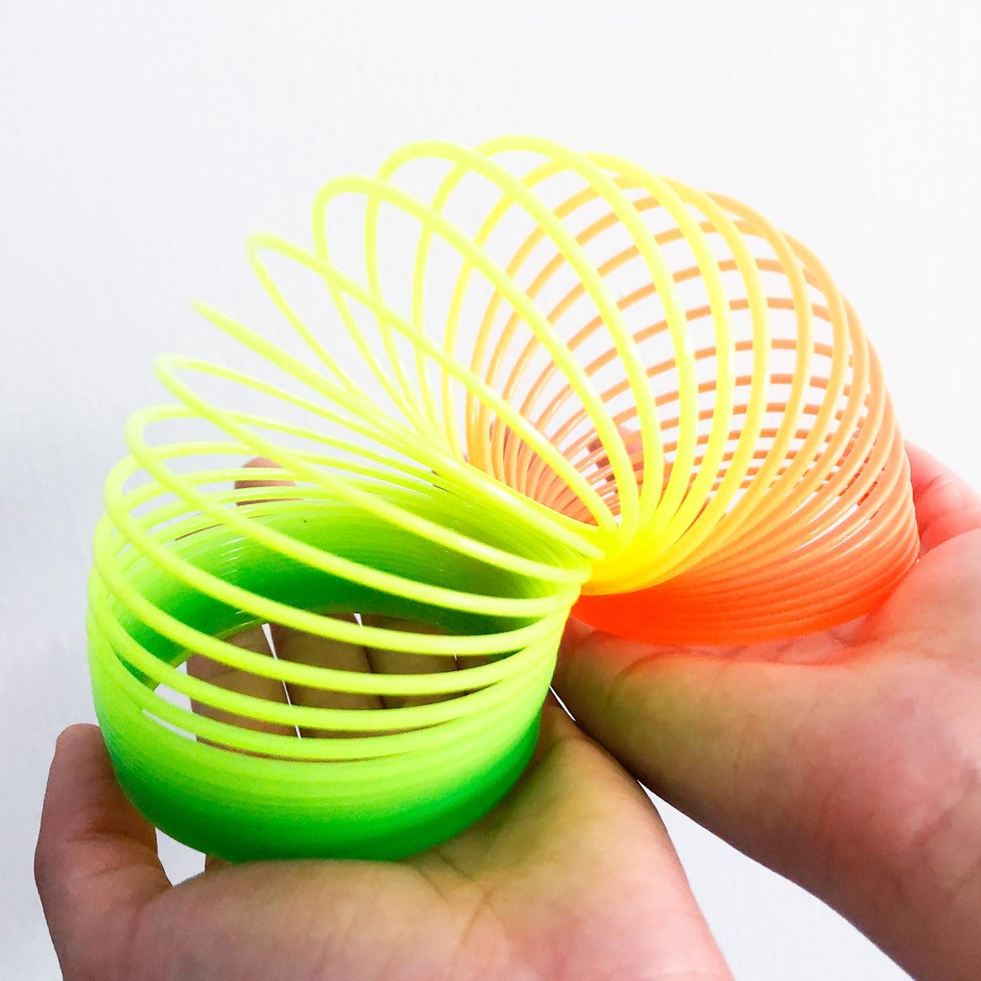 12 Pcs Slinky Toys for Kids Goodie Bag Stuffer Rainbow Slinky Party Favors Spring Toy Slinkies for Carnival Prize Classroom Exchange Gifts (2.5 inches)